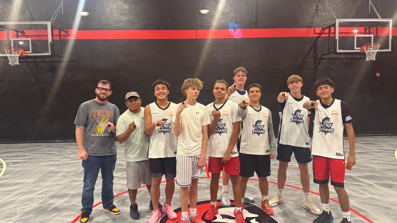 Dominate champions Titans showing their championship rings at center court
