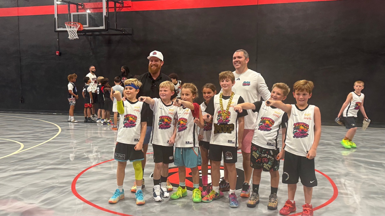 Ignite champions Tropics Storm showing their championship rings at center court