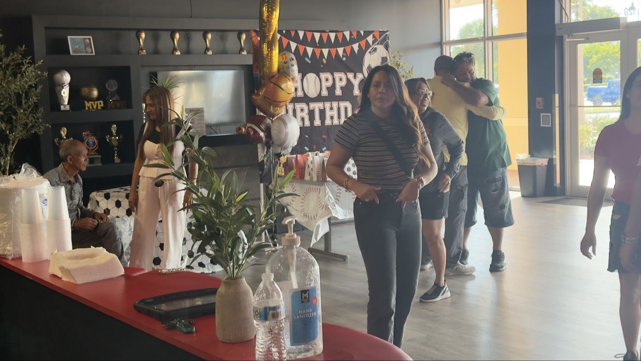 Birthday party setup in the Next Level lobby with a Happy Birthday banner and sports balloons