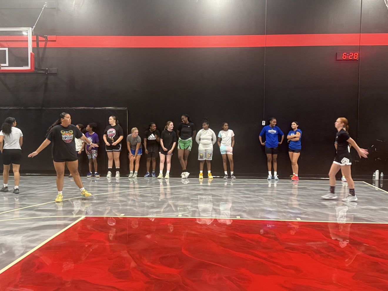 Athletes working on lateral movement in front of their group