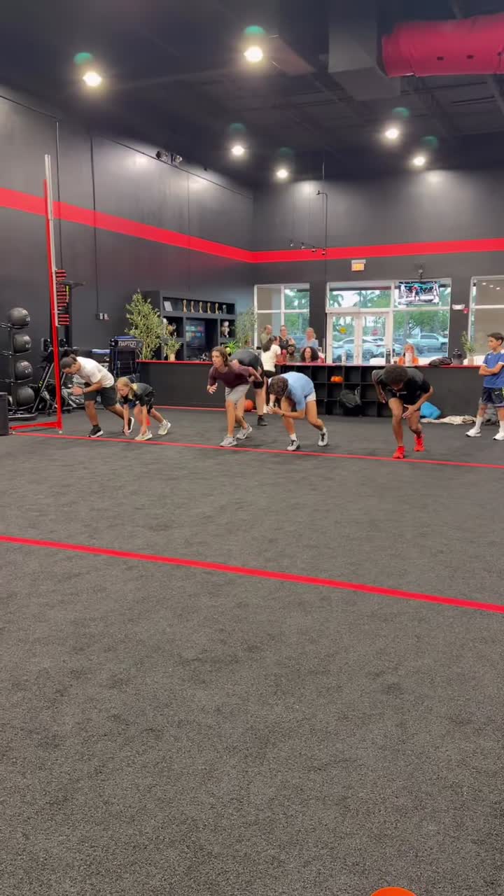 Young athlete working on sprint starts during speed training for kids at Redline Athletics Fort Myers